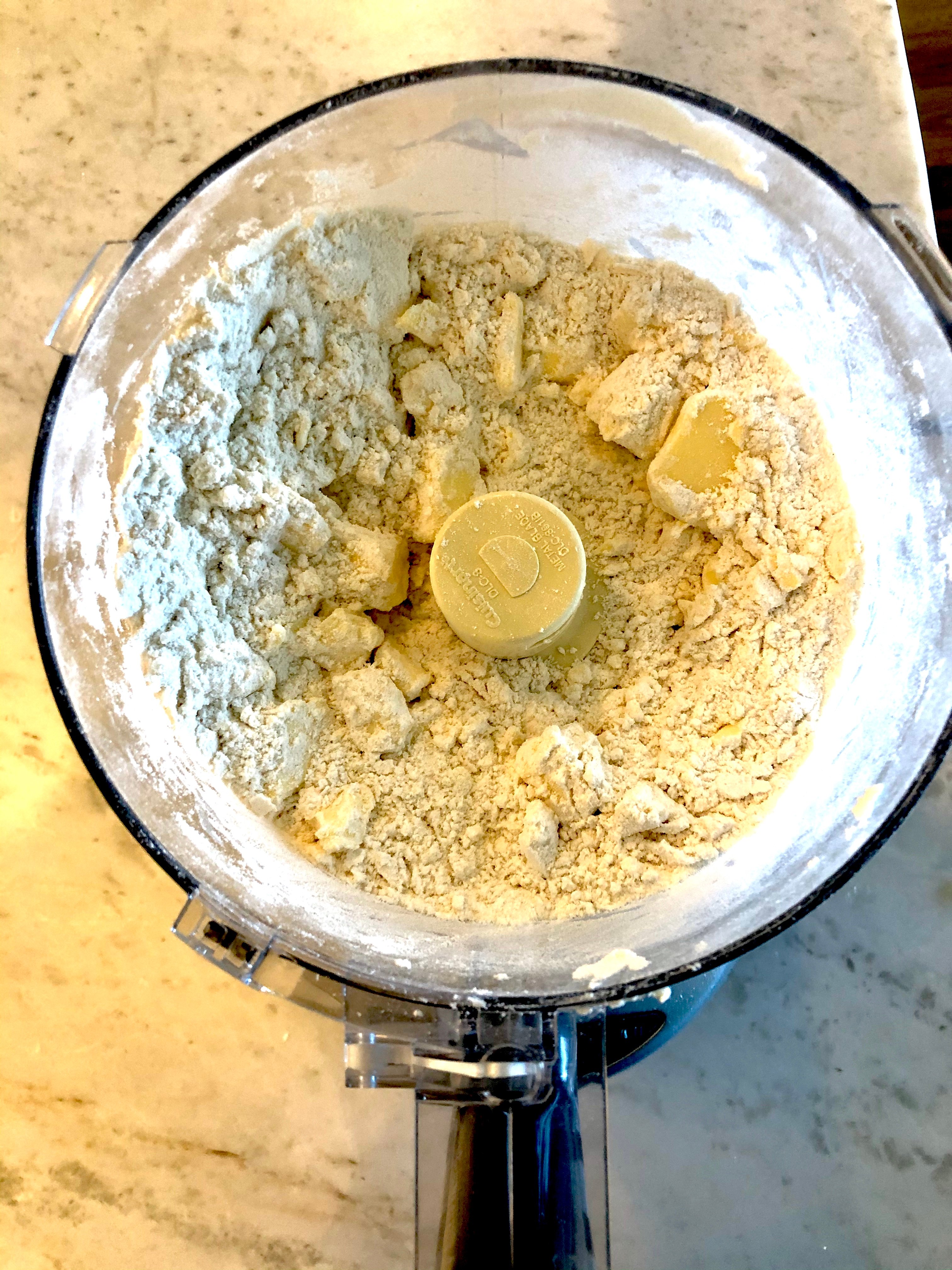 flour and butter blended up in a blender.