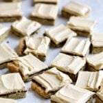 Several peanut butter bars spread on a countertop.