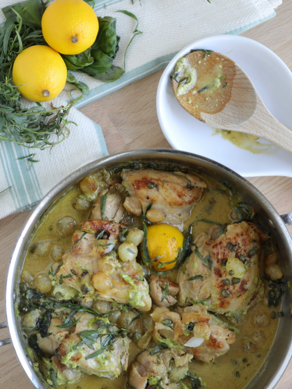 Tarragon chicken with lemon sauce in a pan.