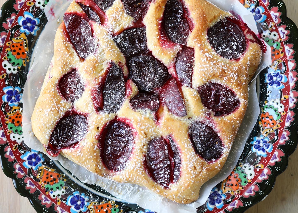 Plum torte on a decorative plate.