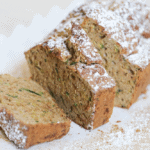 Partially-sliced loaf of cinnamon sugar zucchini bread.
