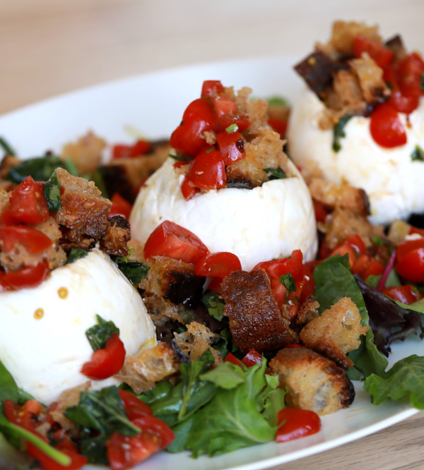 Plate of panzanella stuffed mozzarella.