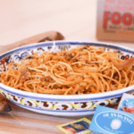 Colorful bowl of Sicilian sardine pasta.