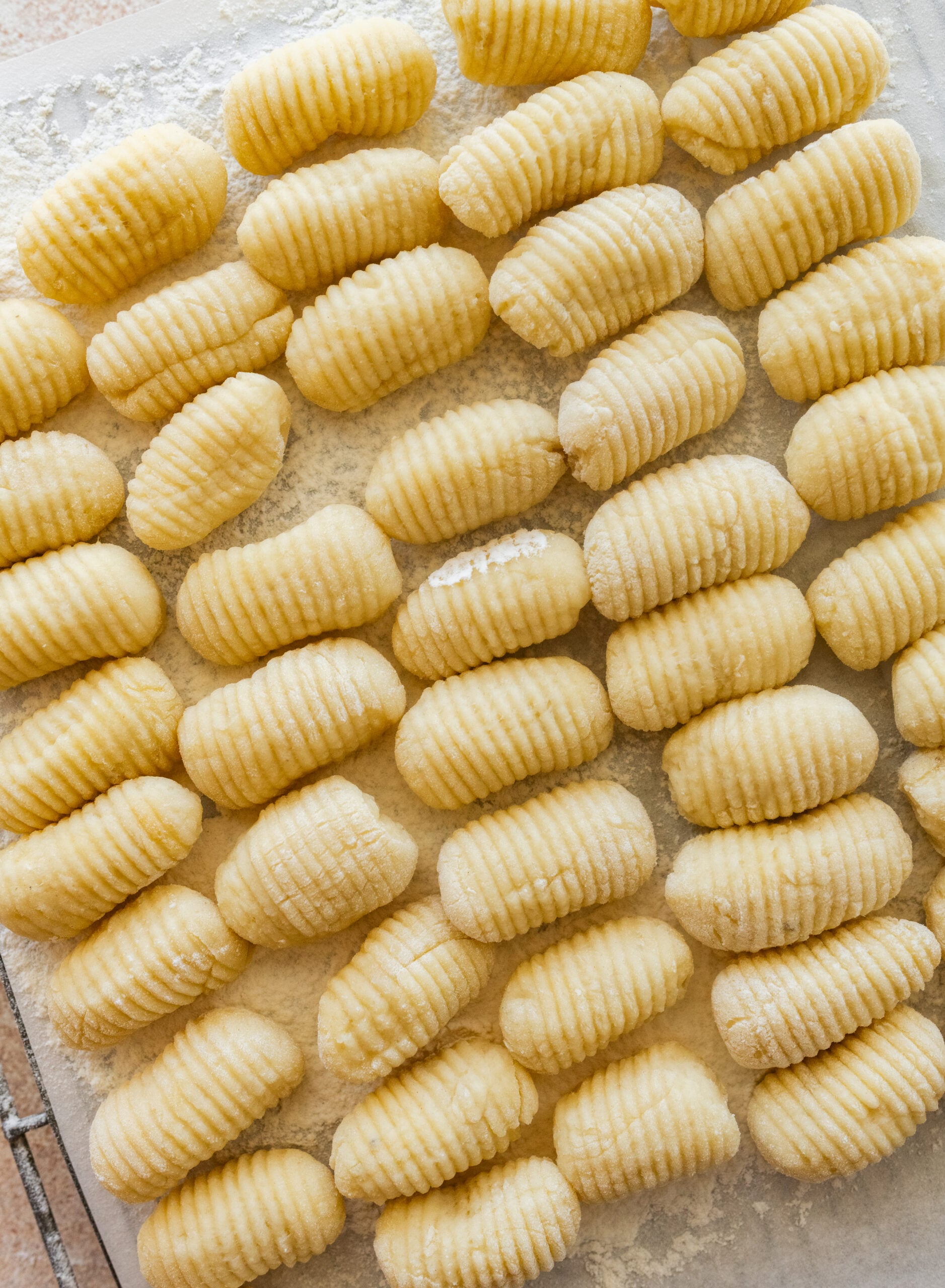 A tray of uncooked gnocchi.
