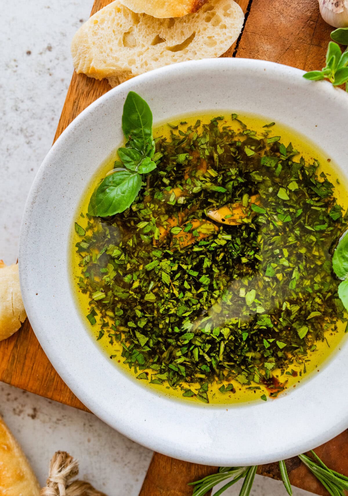 Bread dipping oil served up in a bowl with bread.