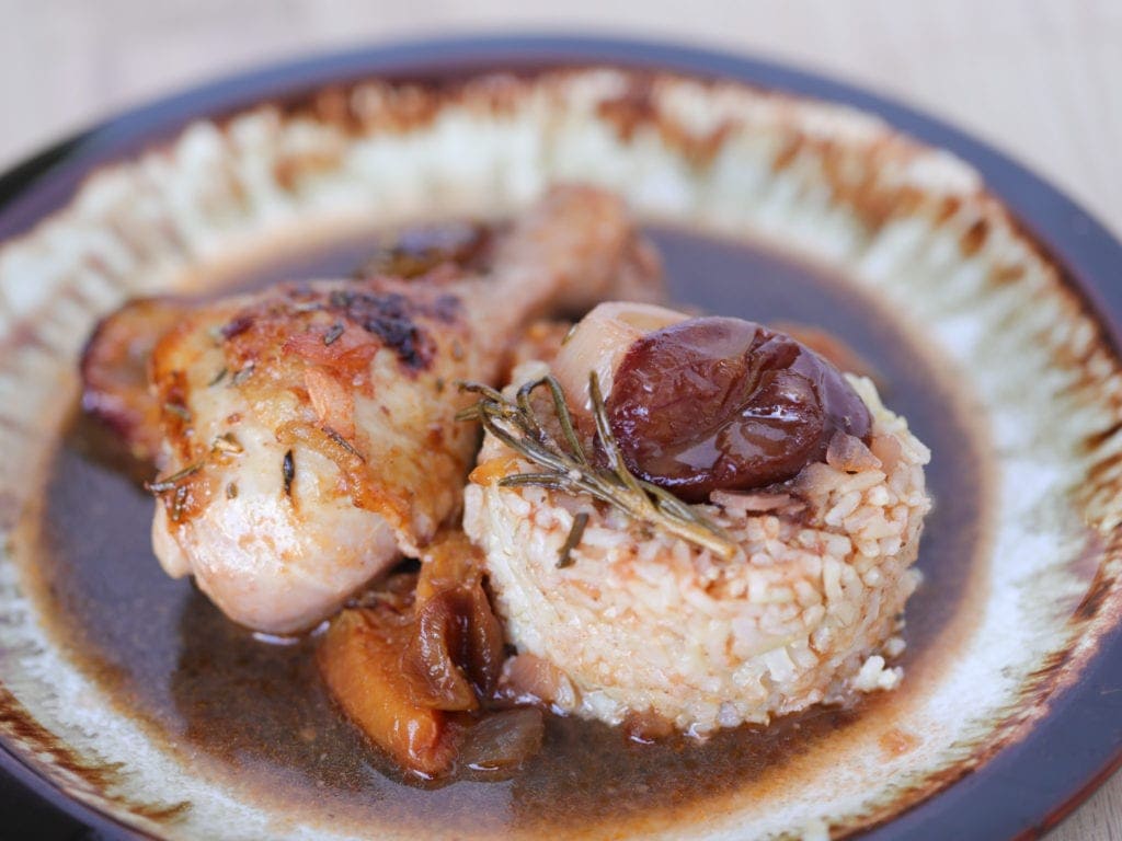 Chicken dish on a brown plate
