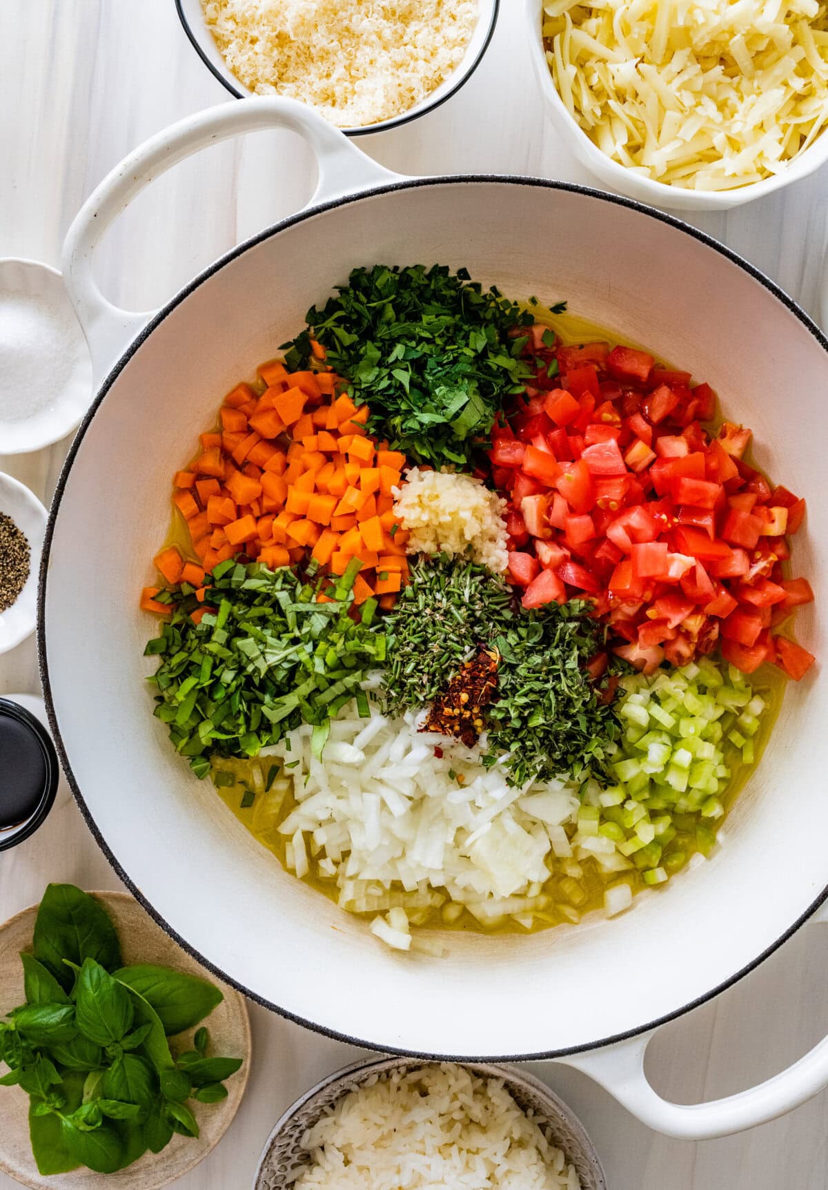 Vegetables added to a skillet to cook.