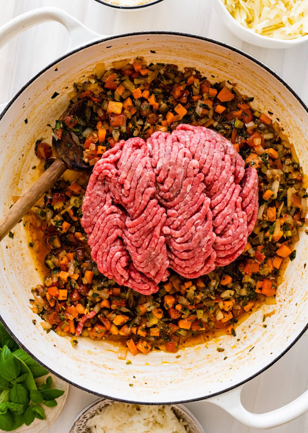 Ground beef added to the skillet.
