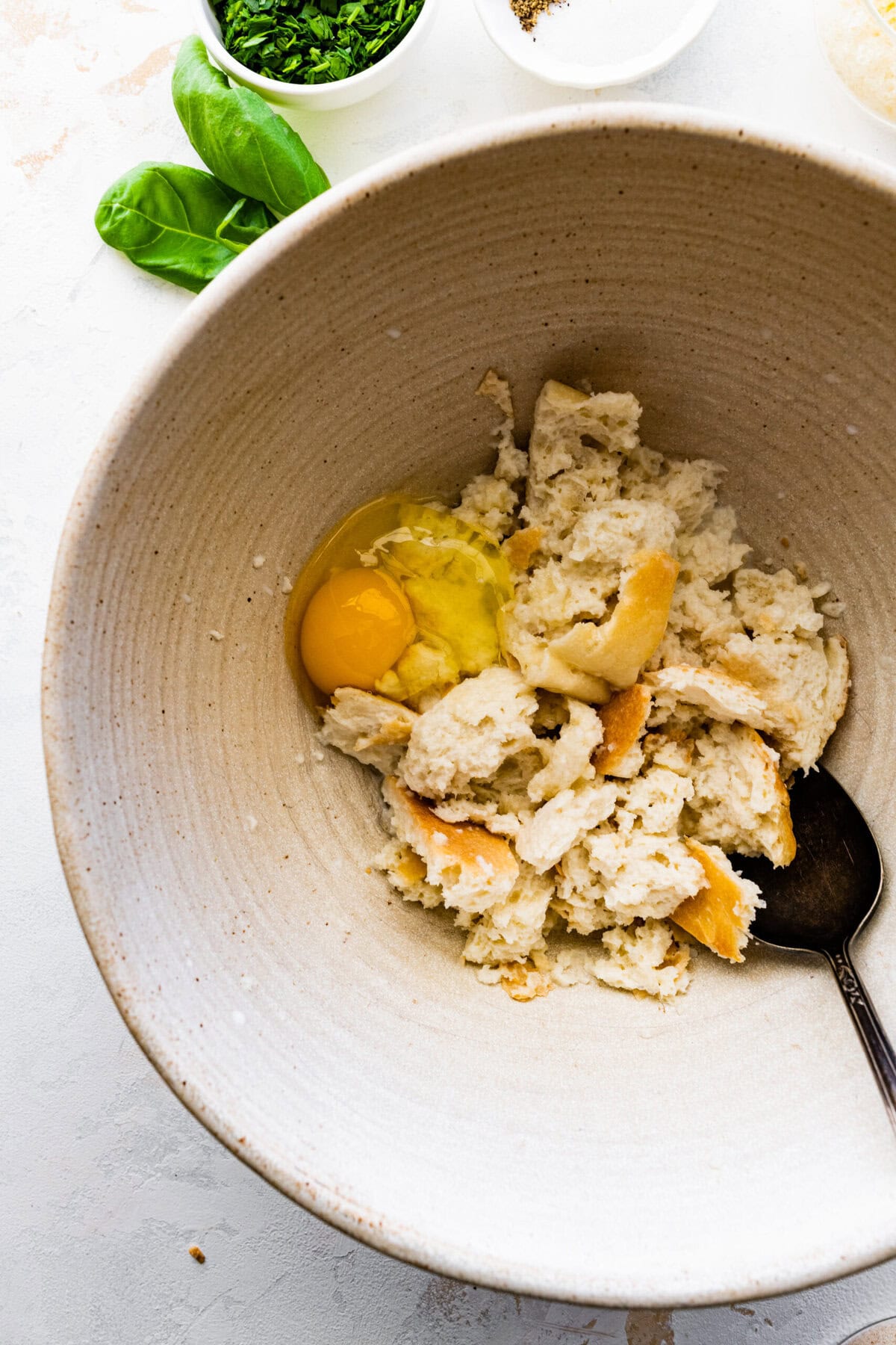 How to make Polpette (Traditional Italian Meatballs) Instructions: mix old bread, egg, and milk in a bowl.