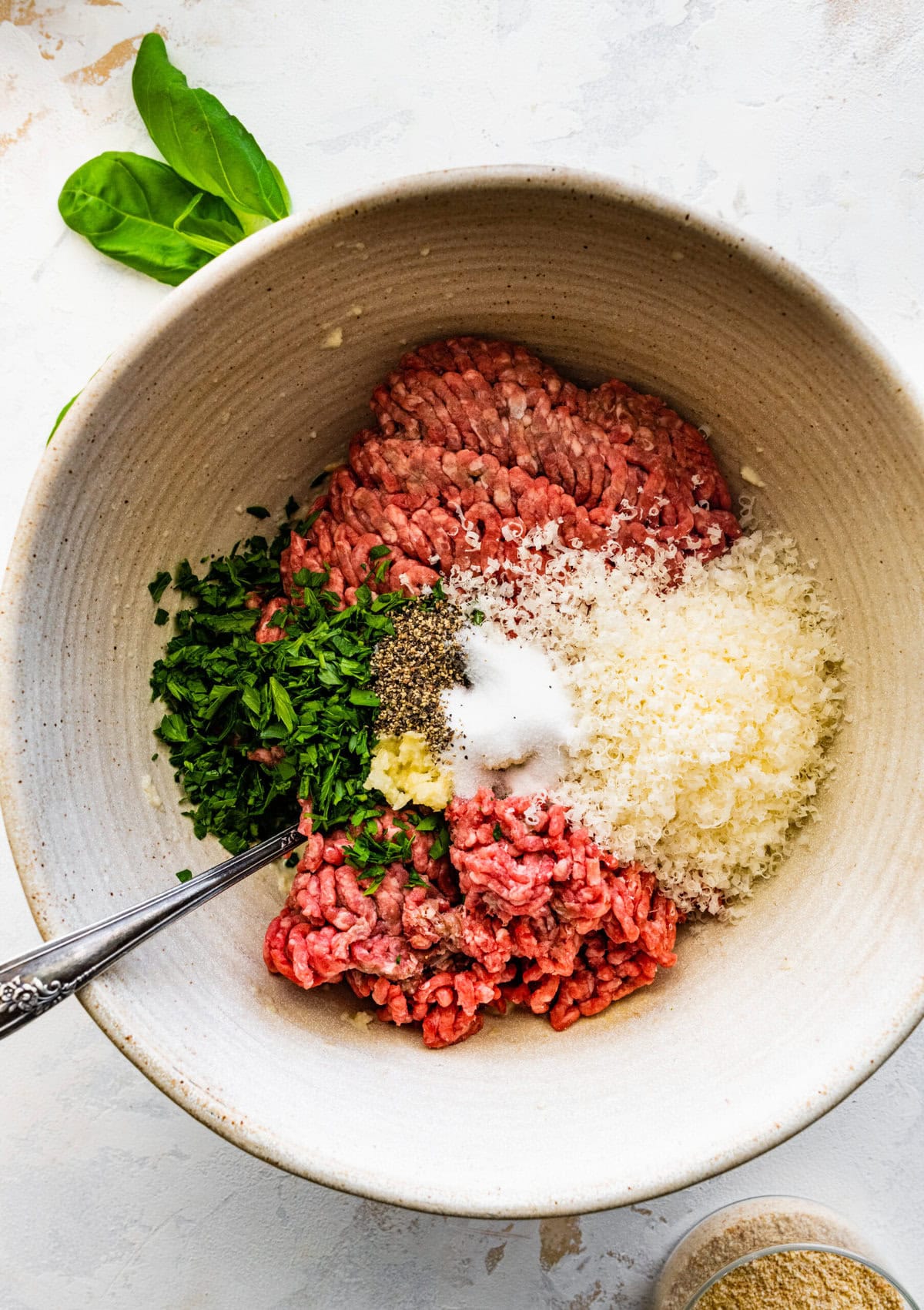 How to make Polpette (Traditional Italian Meatballs) Instructions: add meats, cheese, salt, pepper, and parsley.