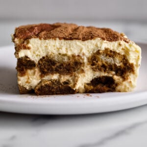 A slice of authentic tiramisu on a plate.