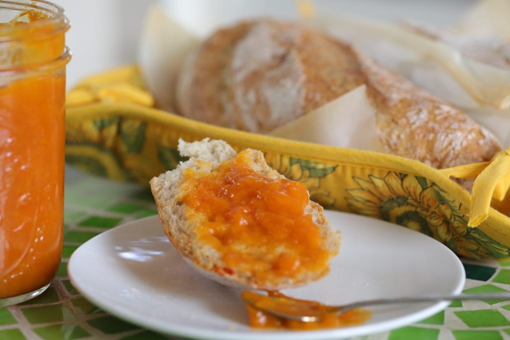 Slice of no-knead bread topped with preserves.