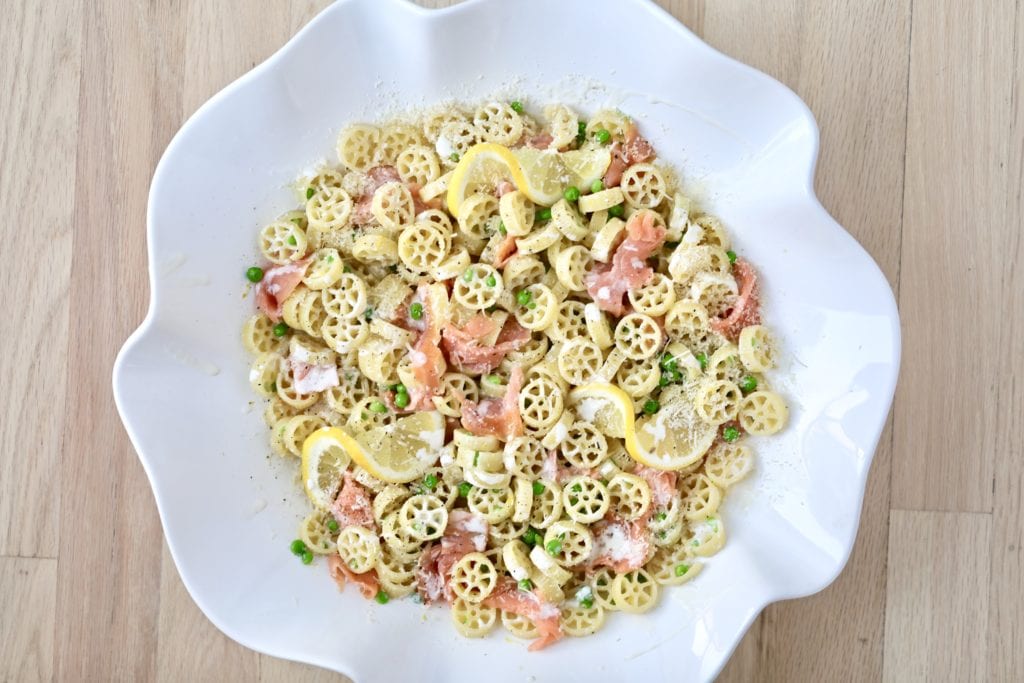 Smoked salmon pasta in a white bowl.