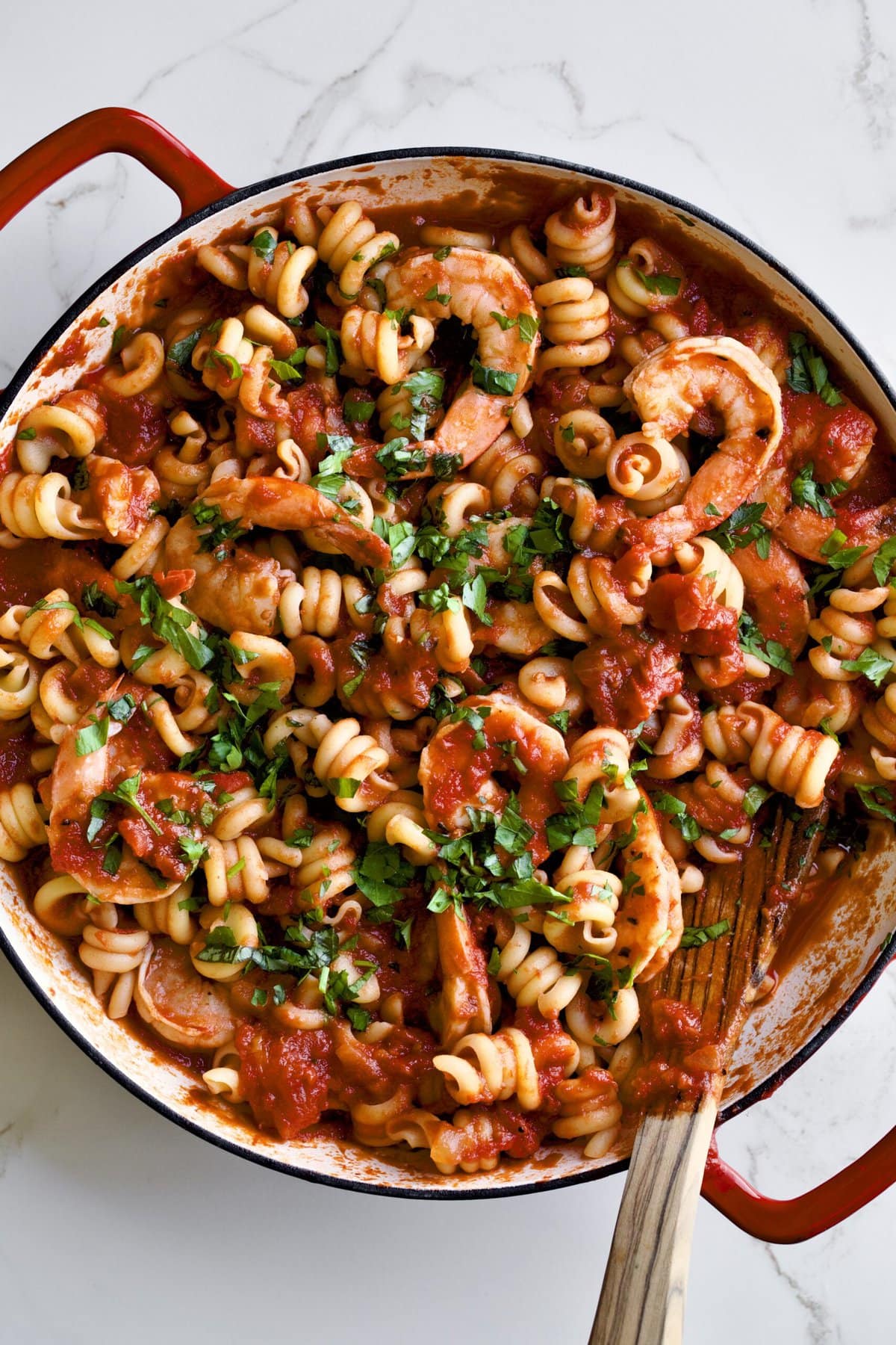 Trottole Pasta Recipe with Tomato Sauce and Shrimp in red enamel pan