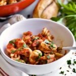 bowl of Trottole Pasta Recipe with Tomato Sauce and Shrimp.