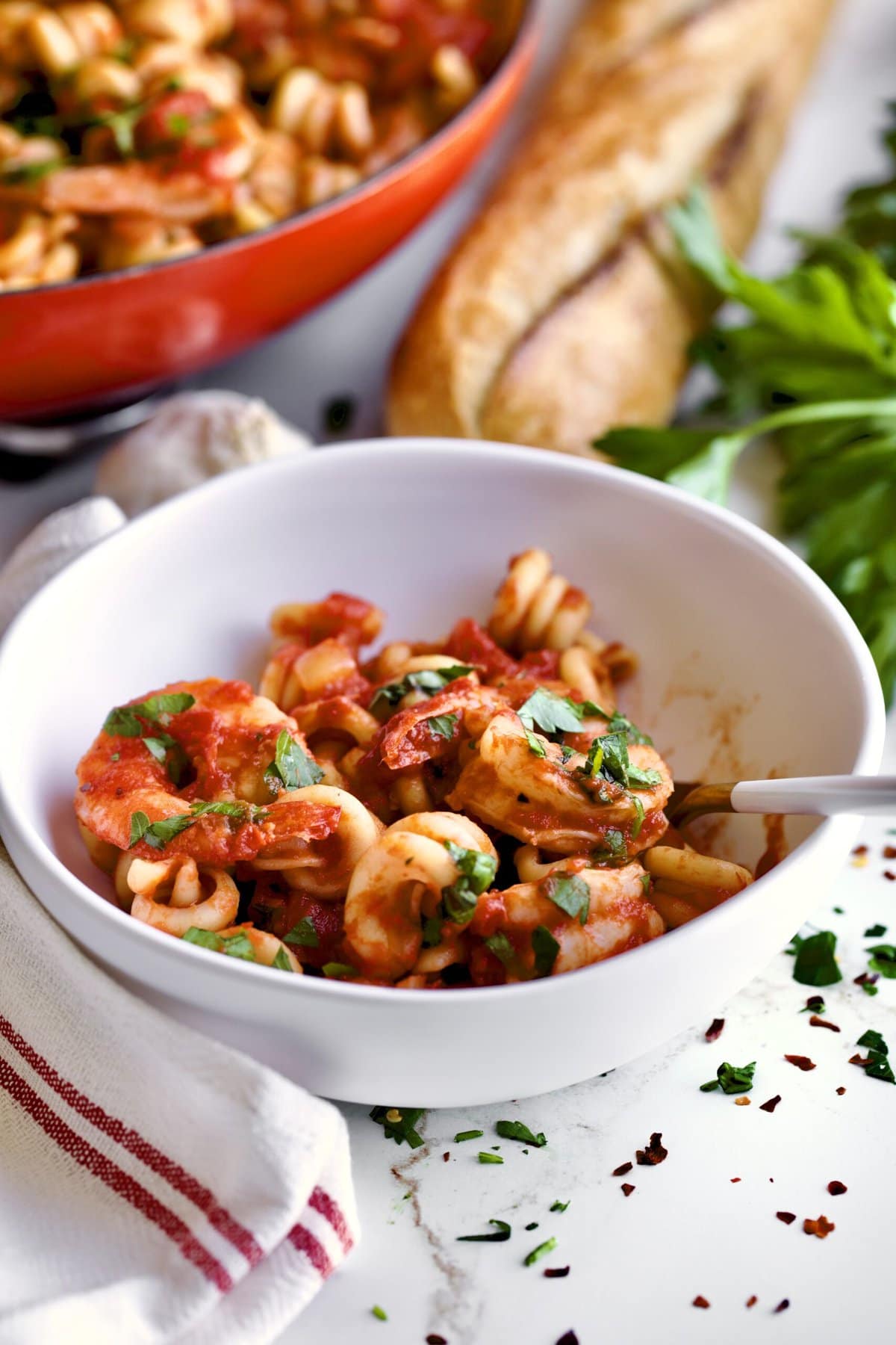 bowl ofTrottole Pasta Recipe with Tomato Sauce and Shrimp.