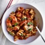 bowl of Trottole Pasta Recipe with Tomato Sauce and Shrimp.