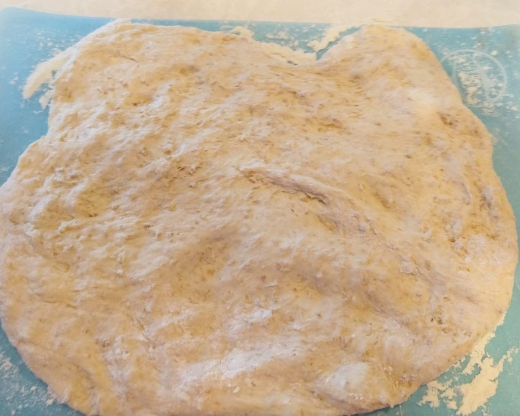 bread dough that is rolled out and ready to fill with mix-in options.