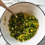Gremolata in a bowl with a spoon ready to use.