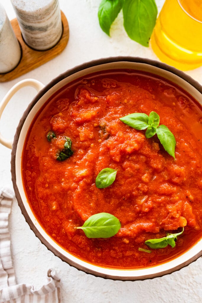 sugo al pomodoro recipe in a rustic pot. 