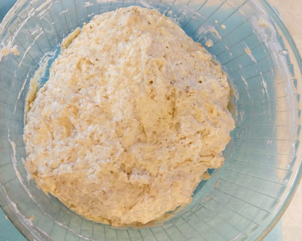 sticky dough after mixing ingredients for Italian no knead bread.