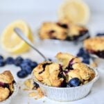 Fork in a blueberry mini pie.
