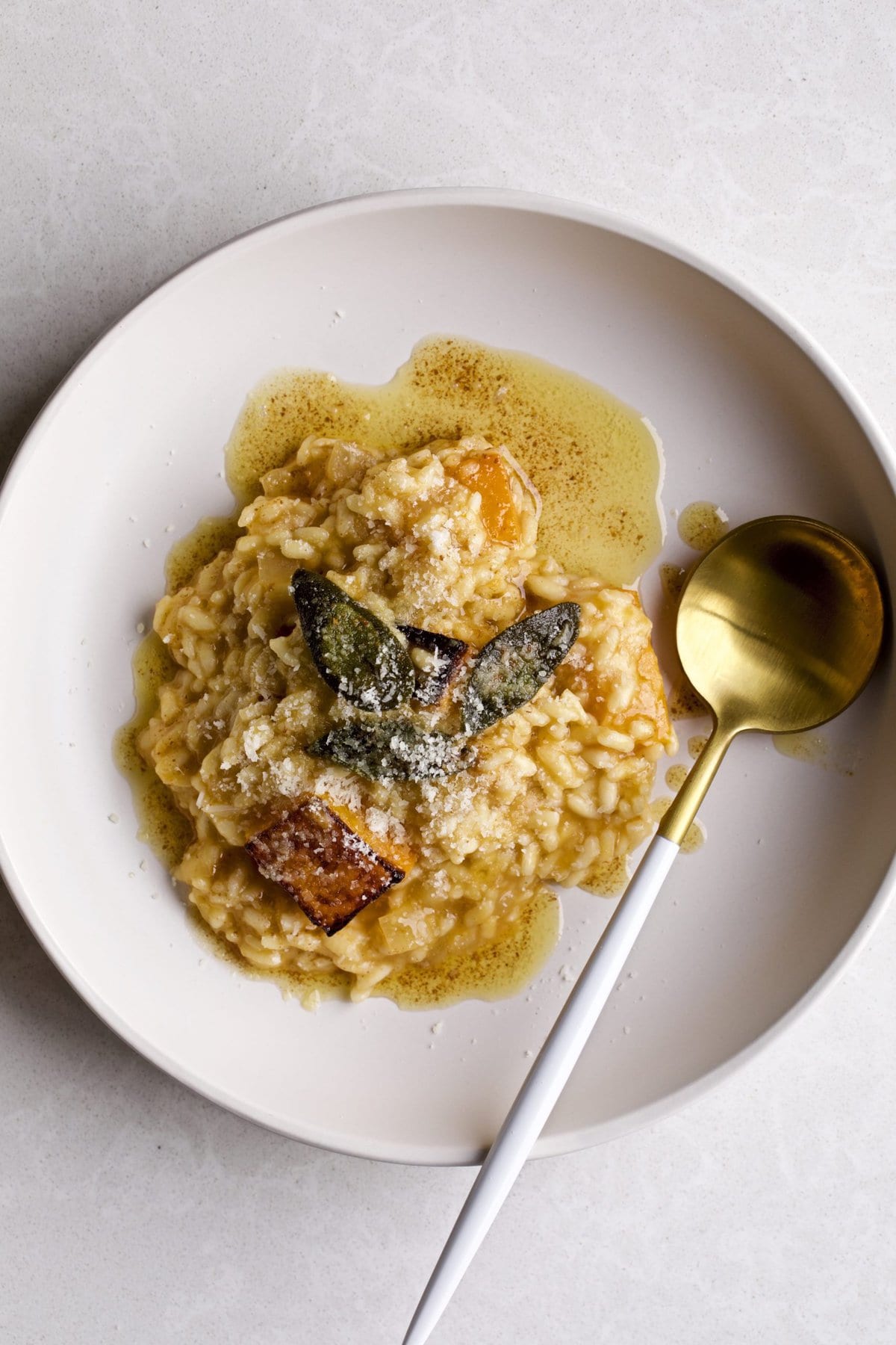 Butternut squash risotto in a square serving bowl