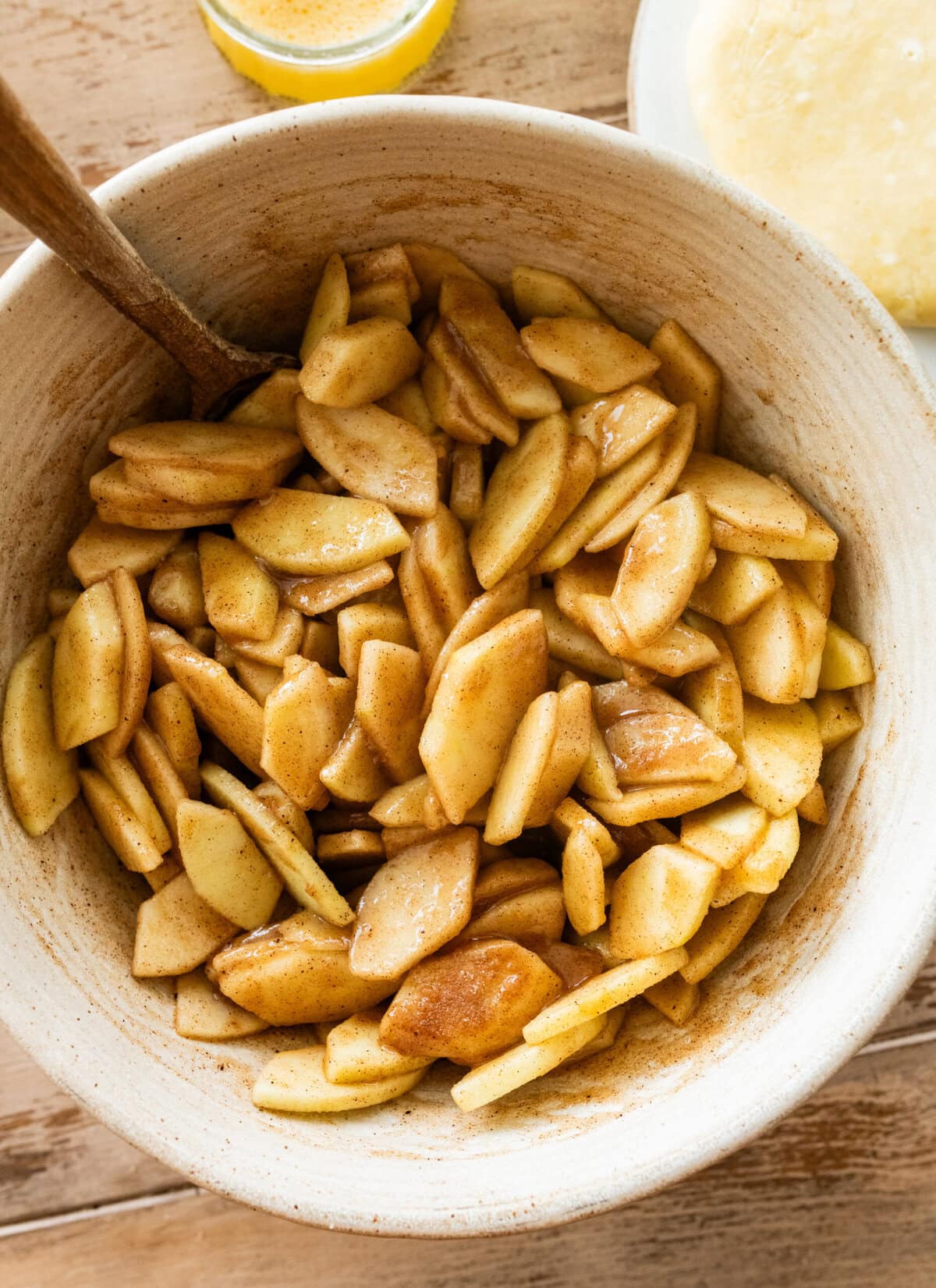 A bowl of the pie filling with a spoon resting inside.