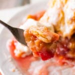 a slice of rhubarb pie with a bite taken out on a fork.