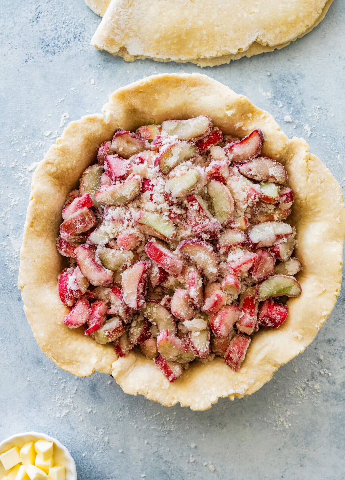 pie crust in a pie pan, with the filling added on top.