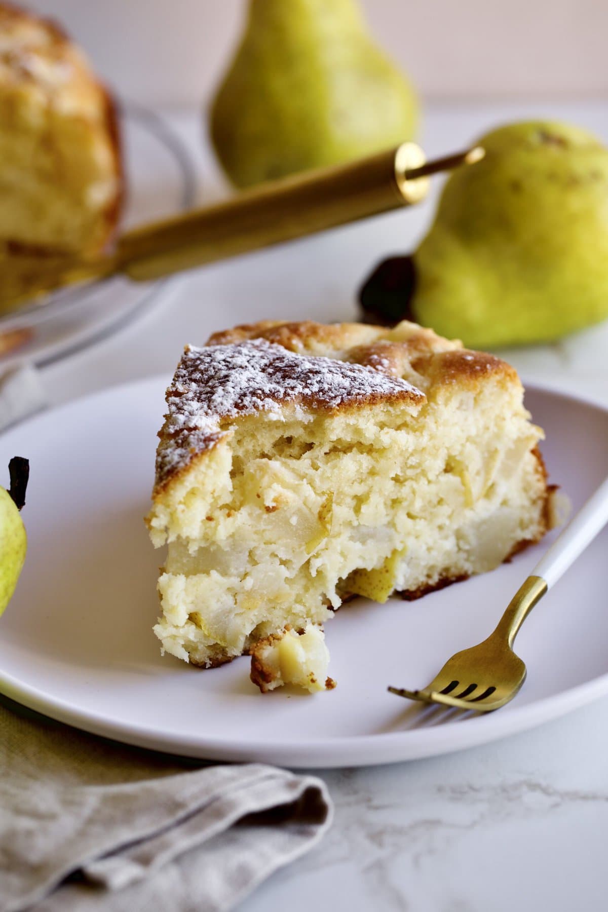 Thick slice of Italian pear cake on a plate 