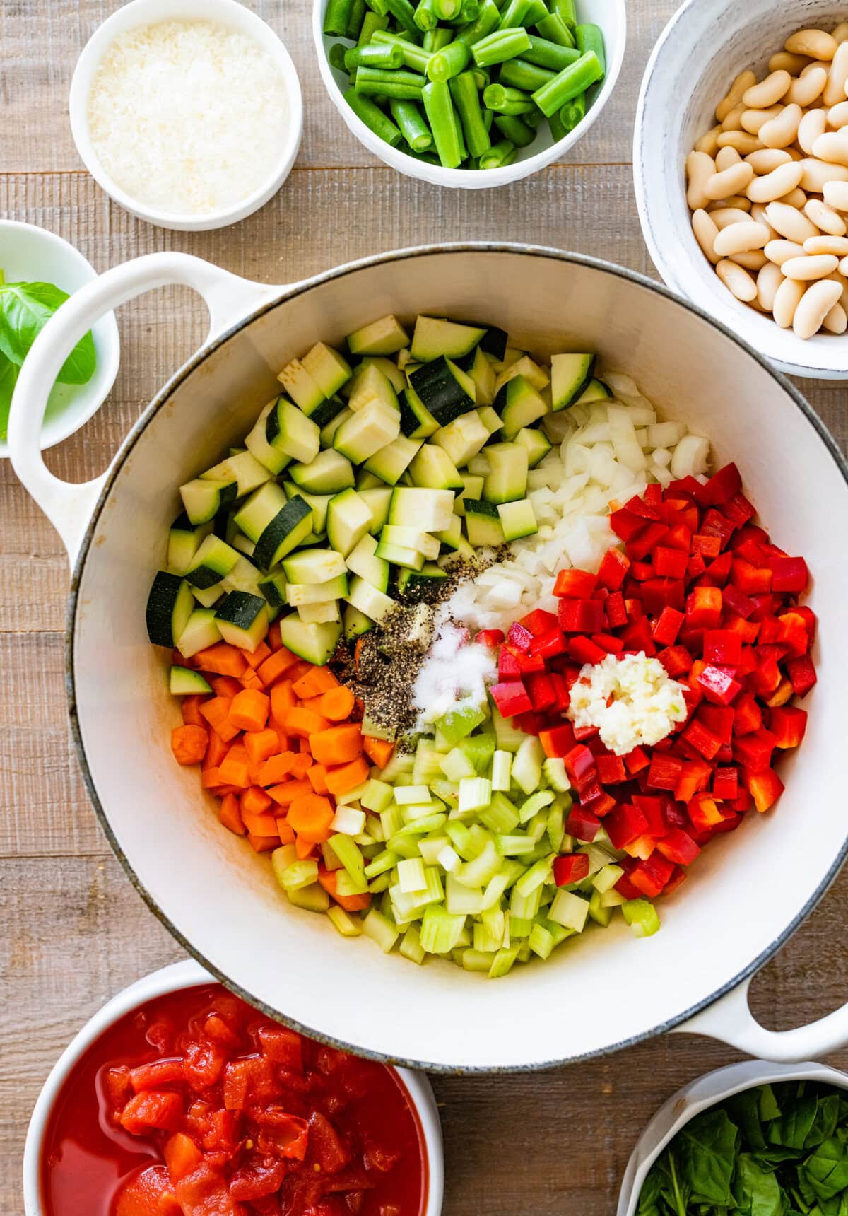 How to make Classic Minestrone Soup Recipe Instructions- place all the veggies in a pot with olive oil.