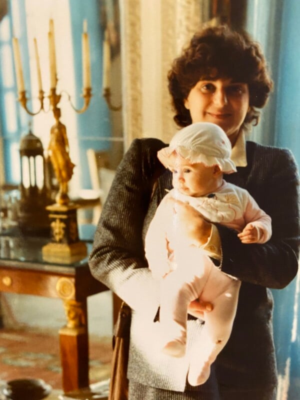 Woman holding a baby.