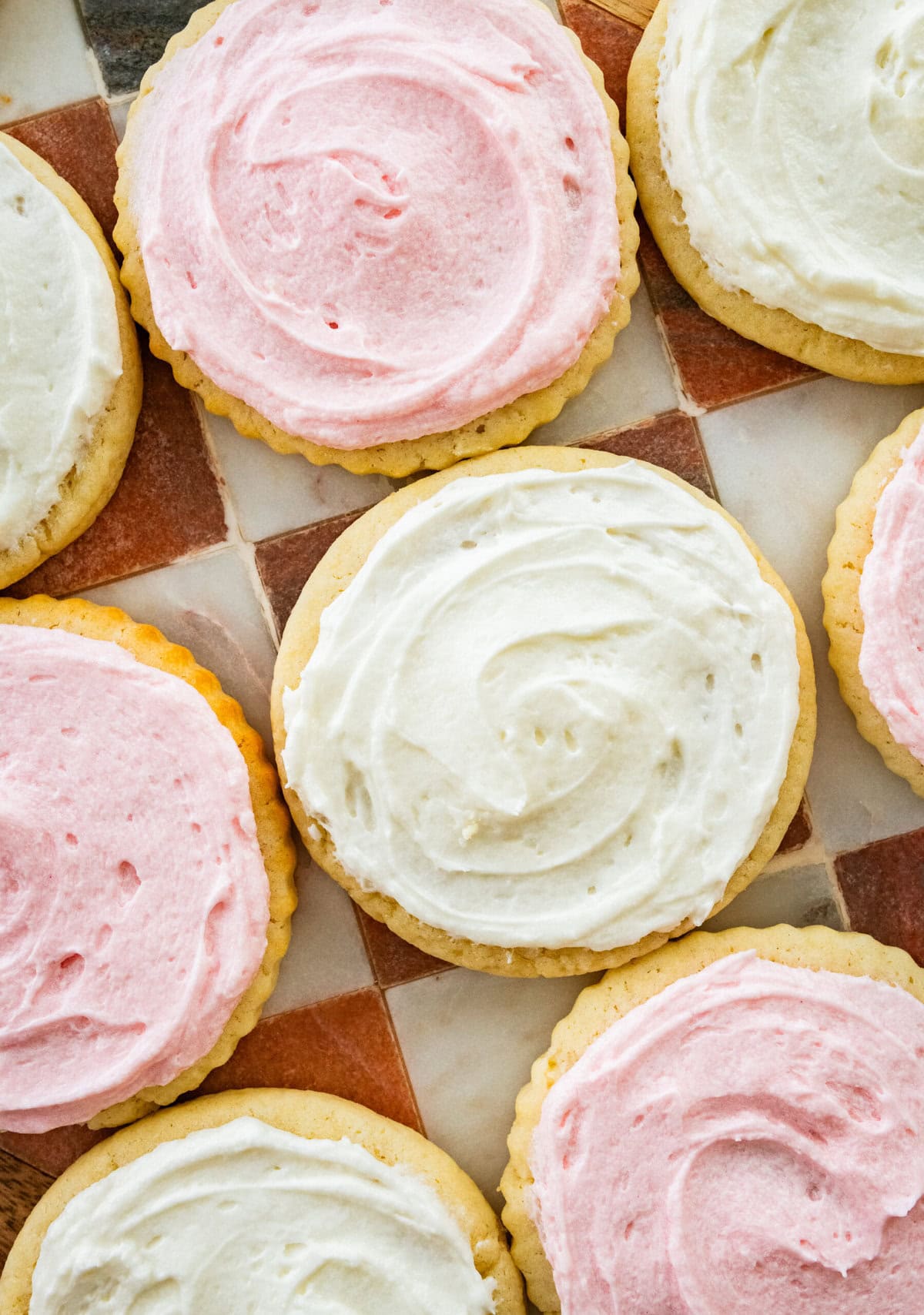 Pink and white sugar cookies with frosting.