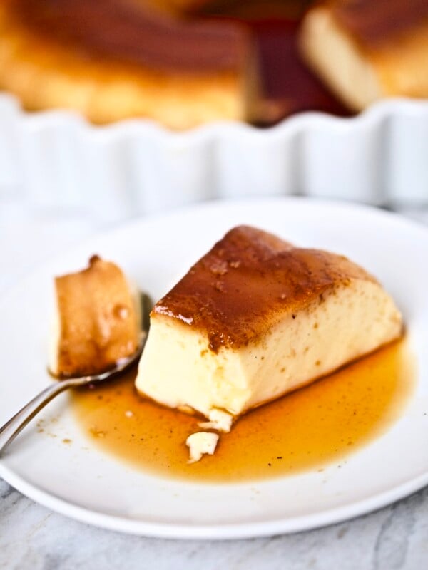 flan on plate with bite taken