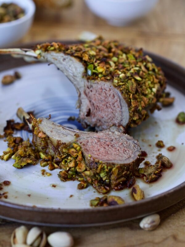 PISTACHIO ROASTED PACK OF LAMB ON A PLATE