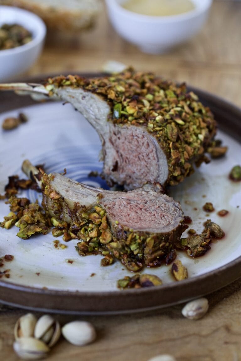 PISTACHIO ROASTED PACK OF LAMB ON A PLATE