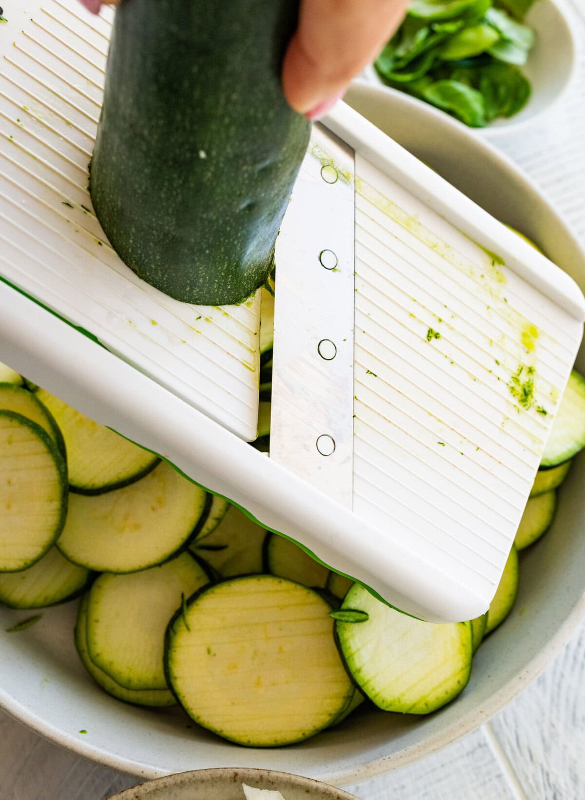 Slicing the zucchini.