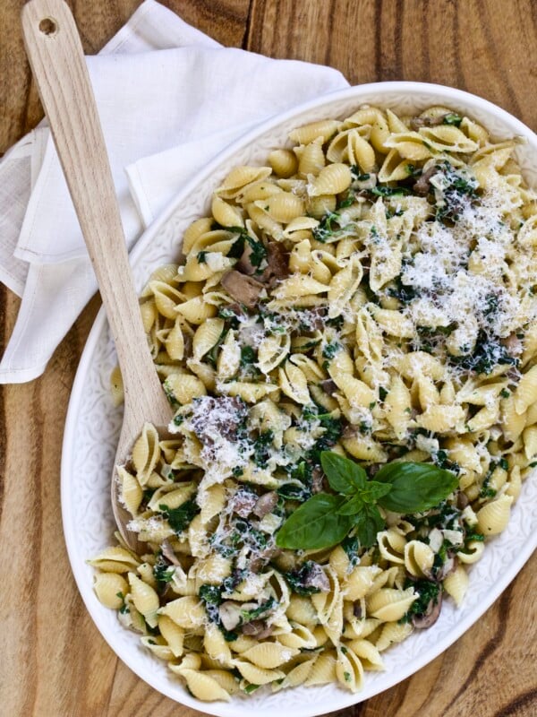 plate of creamy mushroom and spinach pasta shells on serving platter