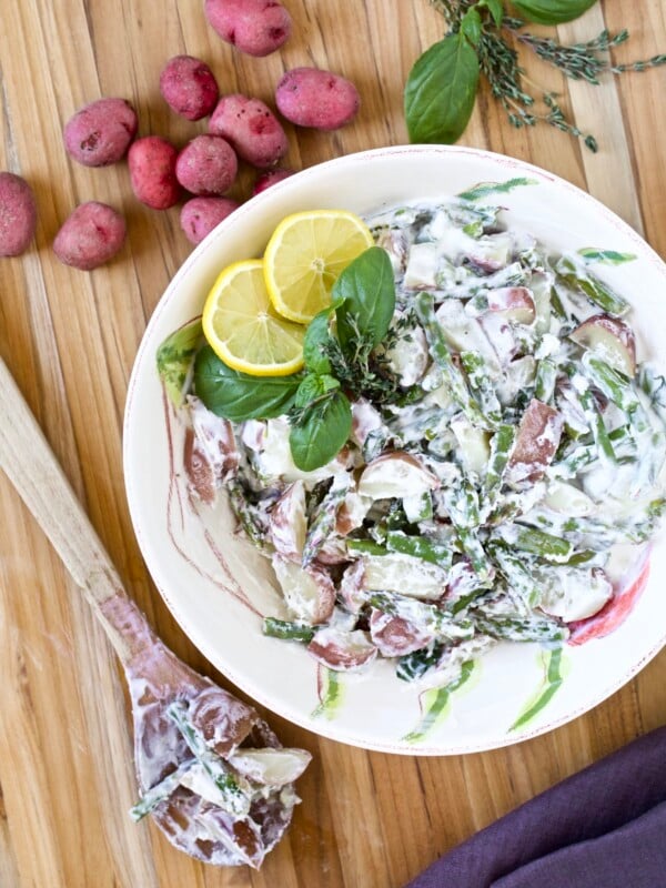 potato salad with lemon and asparagus in a bowl