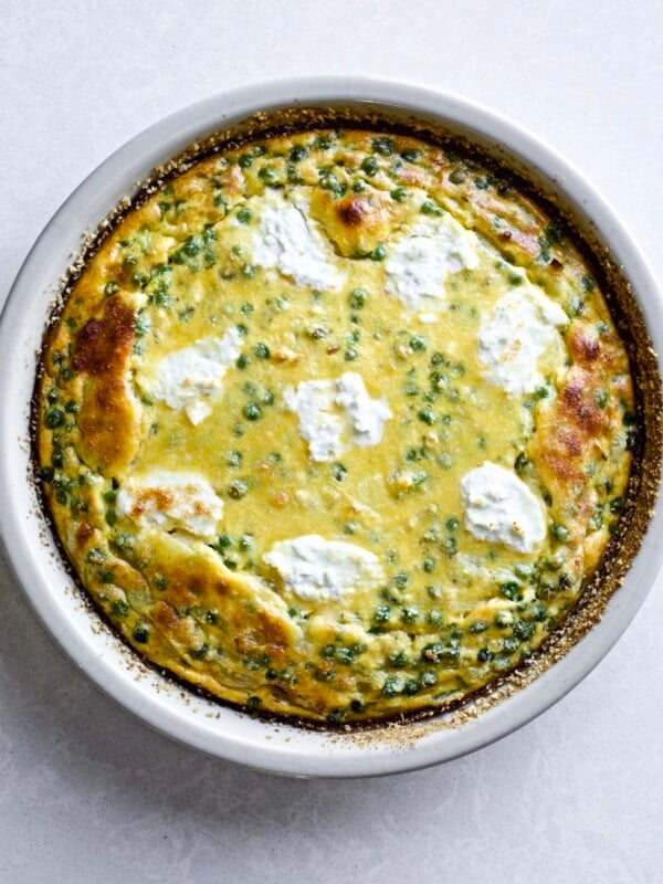 pea and onion frittata in a round baking dish