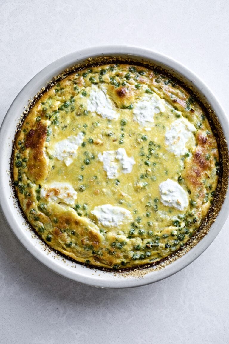 pea and onion frittata in a round baking dish