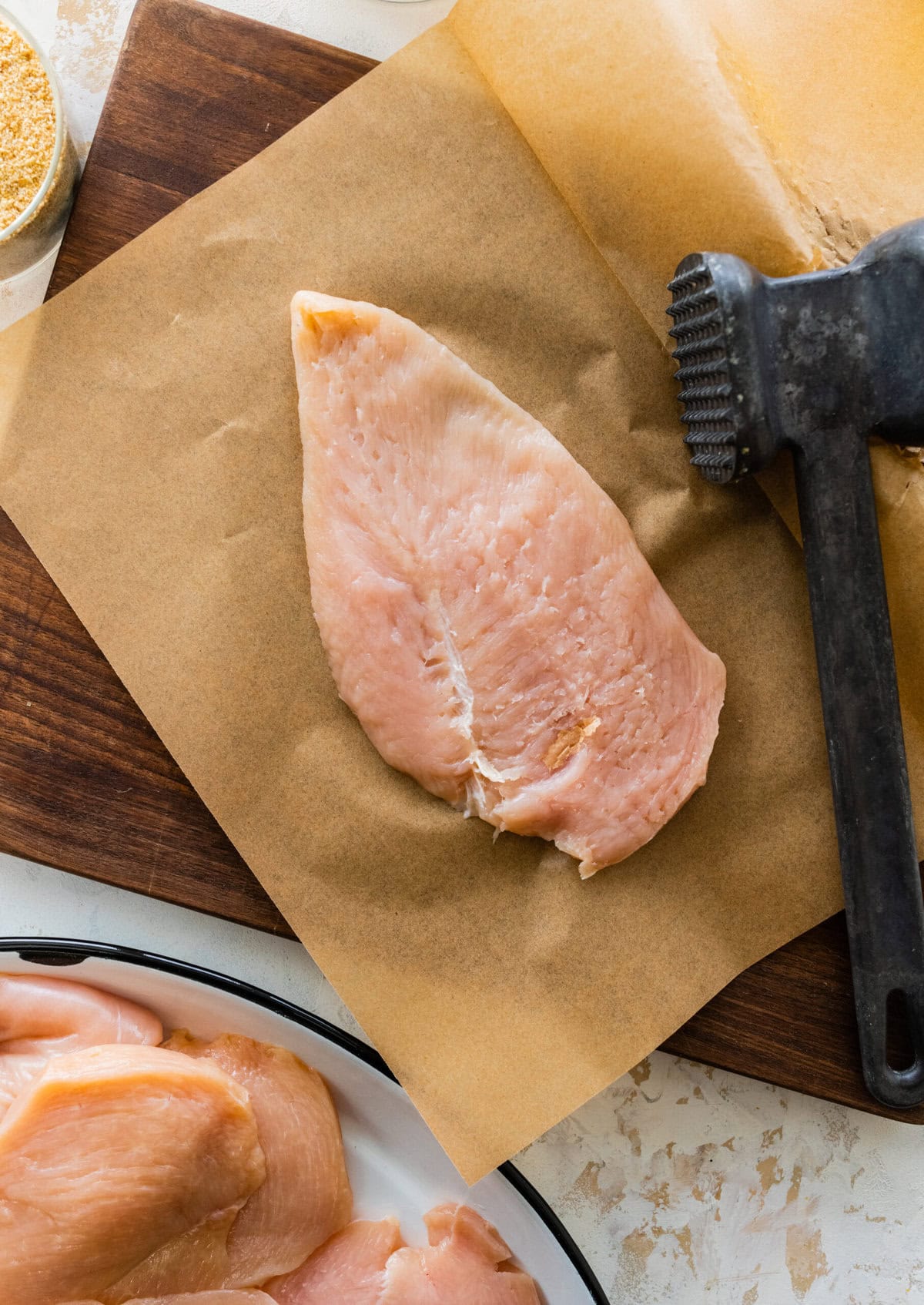 pound the chicken thin with a meat mallet.