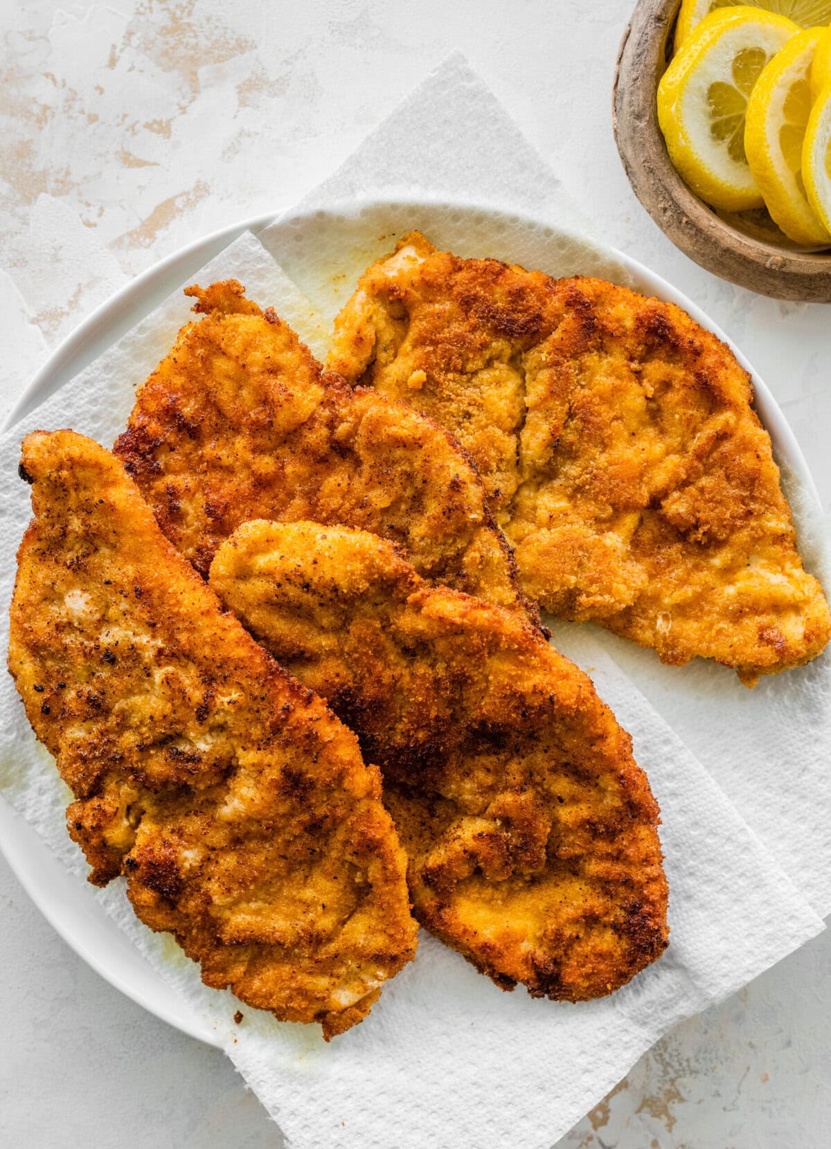 fried chicken on a paper towel to absorb excess oil.
