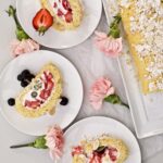 Vanilla Cake Roll with Berries slices on a several plates