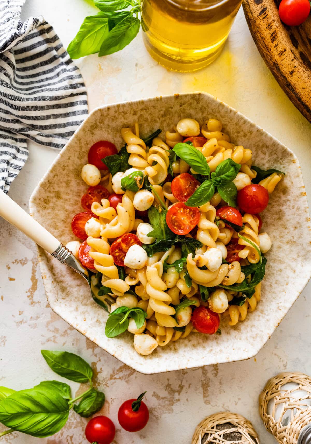 Caprese pasta salad with tomatoes, mozzarella and basil