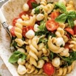 Caprese pasta salad with tomatoes, mozzarella and basil