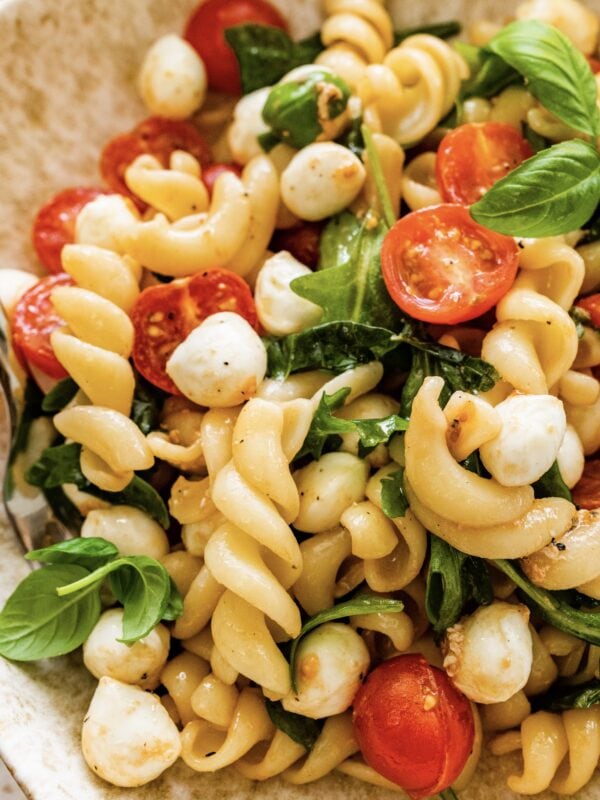 Caprese pasta salad with tomatoes, mozzarella and basil