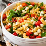 Pasta salad with tomatoes, spinach, and cheese