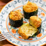 twice baked zucchini with a bite taken out so you can see the inside.